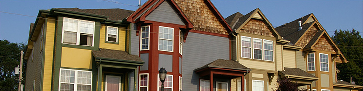 A row of multicolored homes.